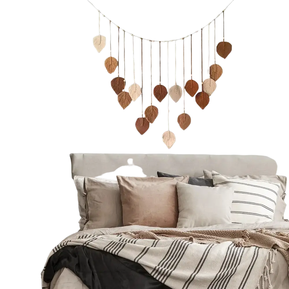A macrame leaf wall hanging in earthy tones made of natural fiber cords for boho decor
