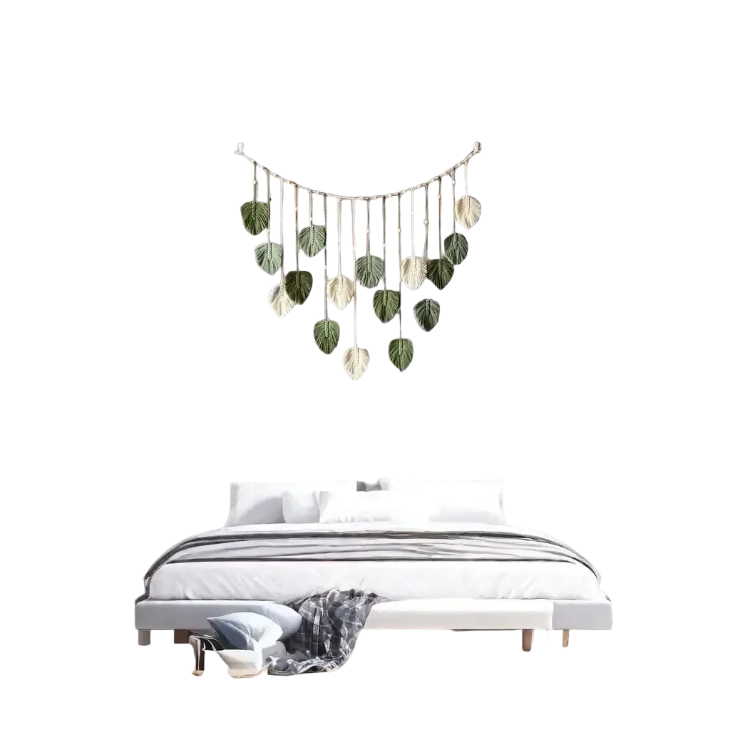 Macrame leaf wall hanging with curved metal frame and green cream leaf ornaments for boho home decor