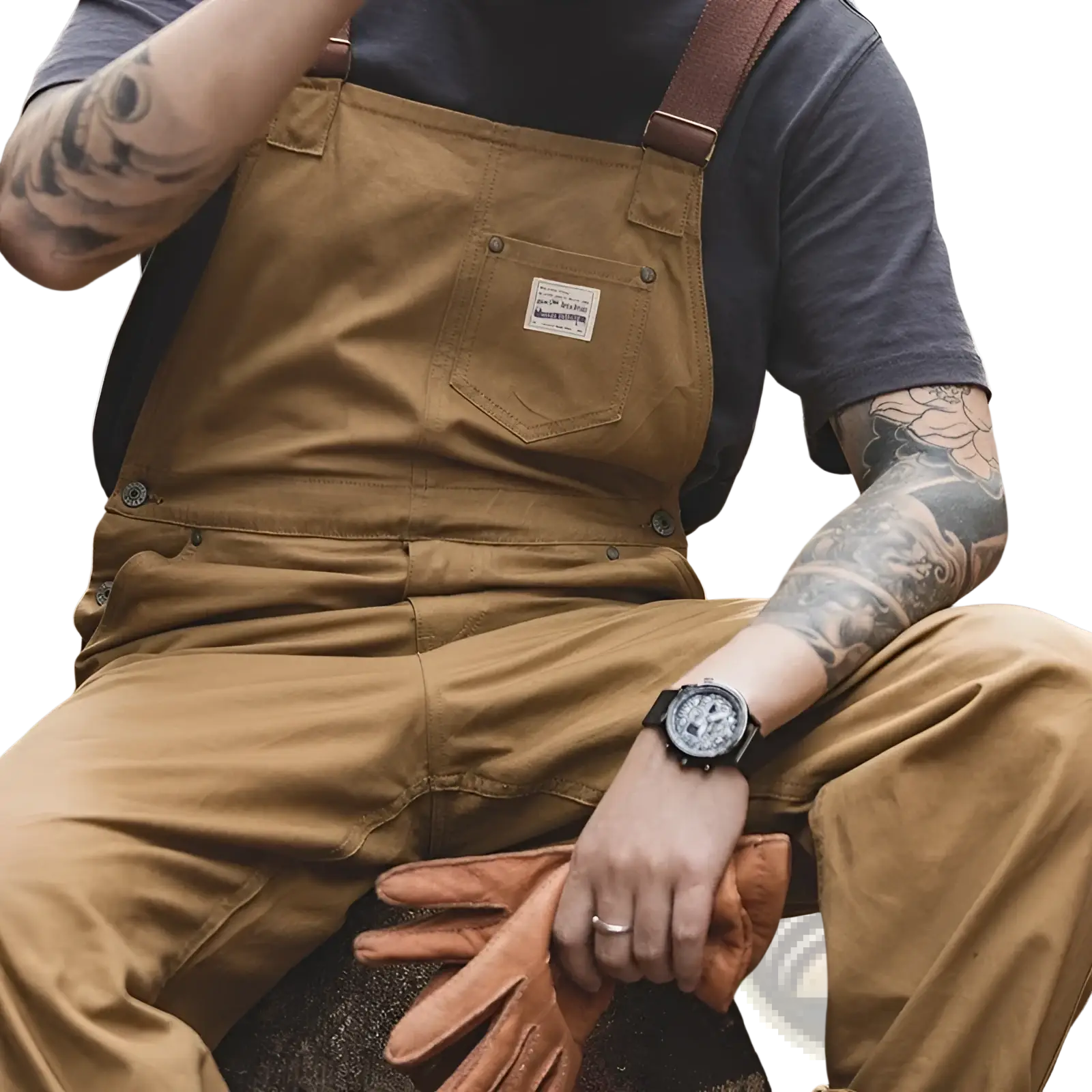 Maden vintage tan canvas workwear overalls with brown leather straps and a white label on the chest pocket