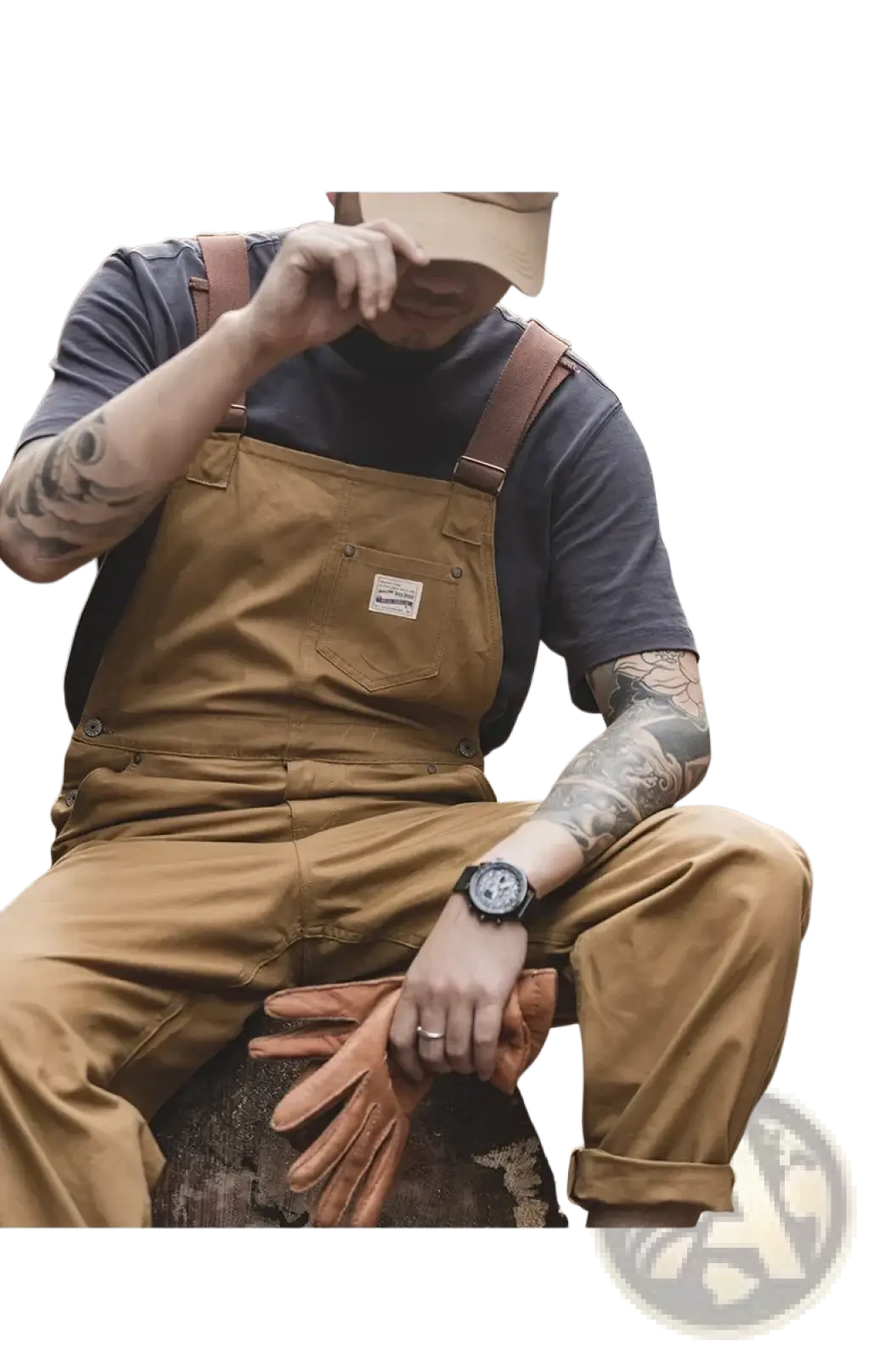 Tan canvas workwear overalls with brown leather straps and a small branded patch on the chest pocket