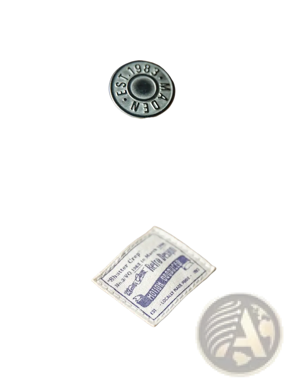 A vintage decorative metallic dark gray button engraved est on Maden vintage tan canvas workwear overalls