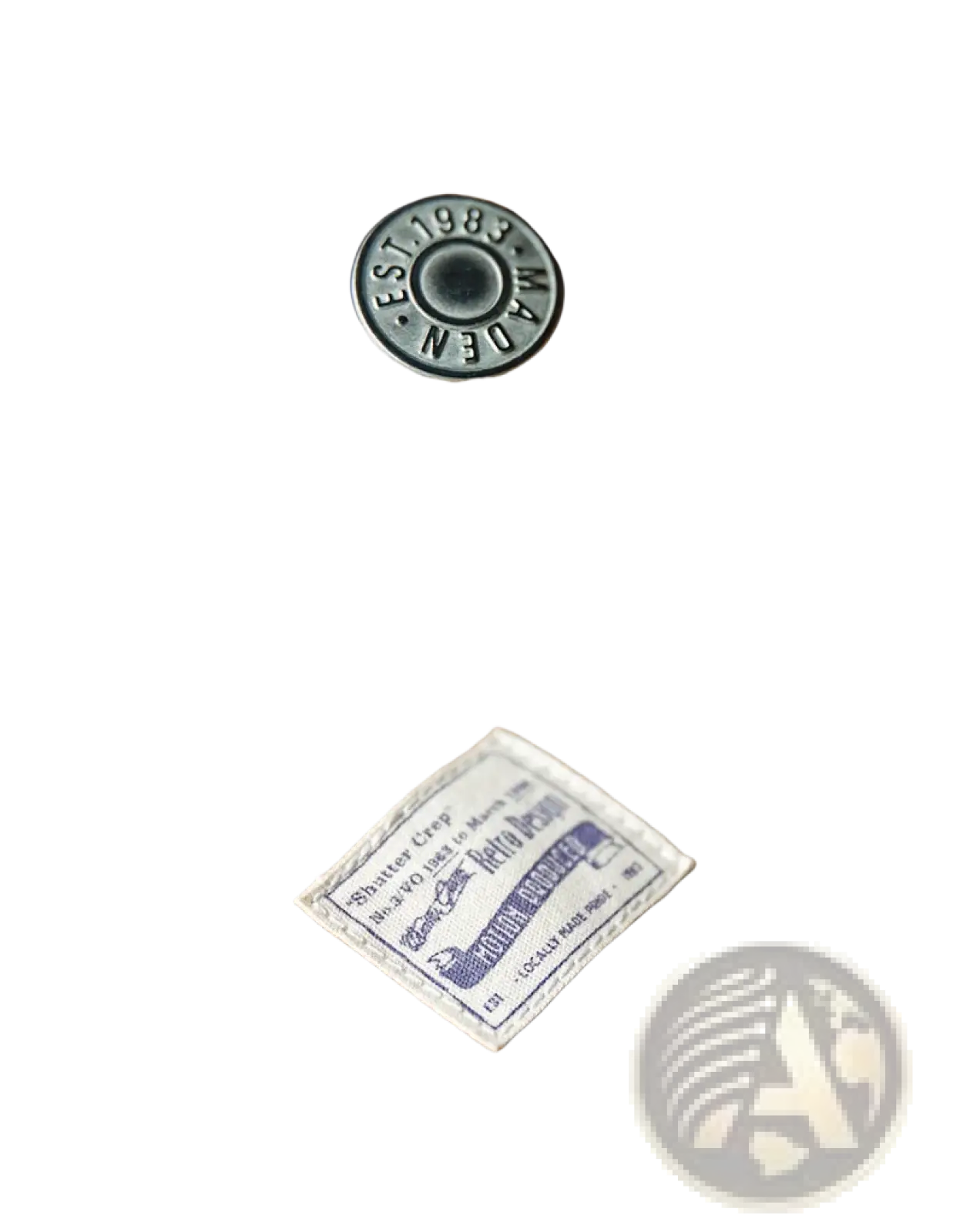 A vintage decorative metallic dark gray button engraved est on Maden vintage tan canvas workwear overalls