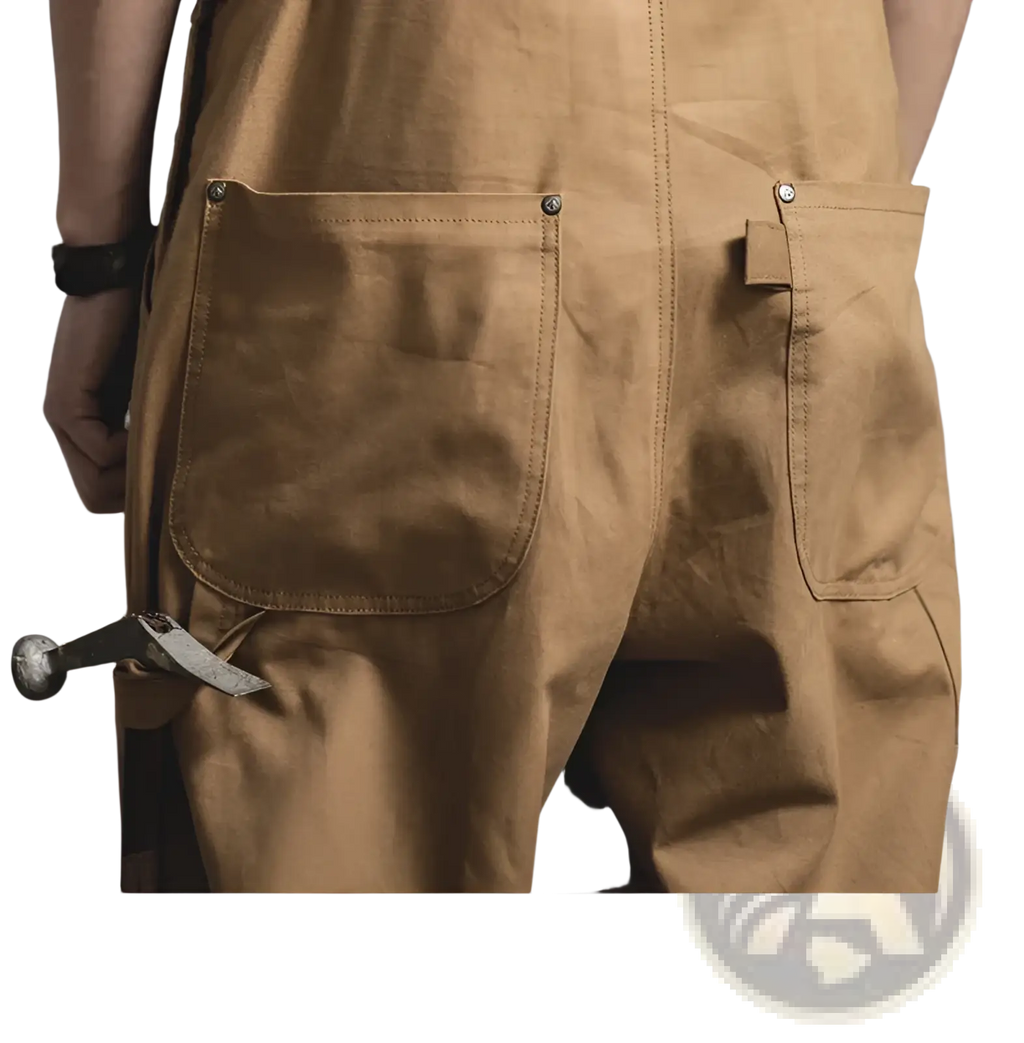 Back view of maden vintage tan canvas workwear overalls featuring tan waxed canvas with sturdy stitching and metal rivets