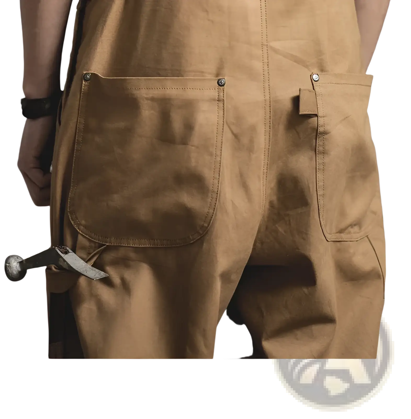 Back view of maden vintage tan canvas workwear overalls featuring tan waxed canvas with sturdy stitching and metal rivets