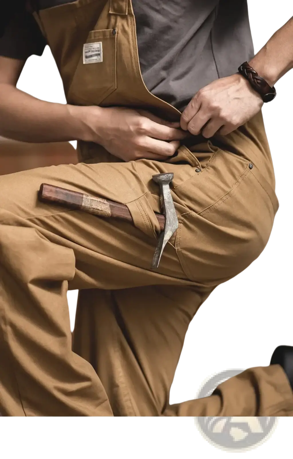 Maden vintage tan canvas workwear overalls with sturdy durable fabric and multiple pockets including one holding a hammer