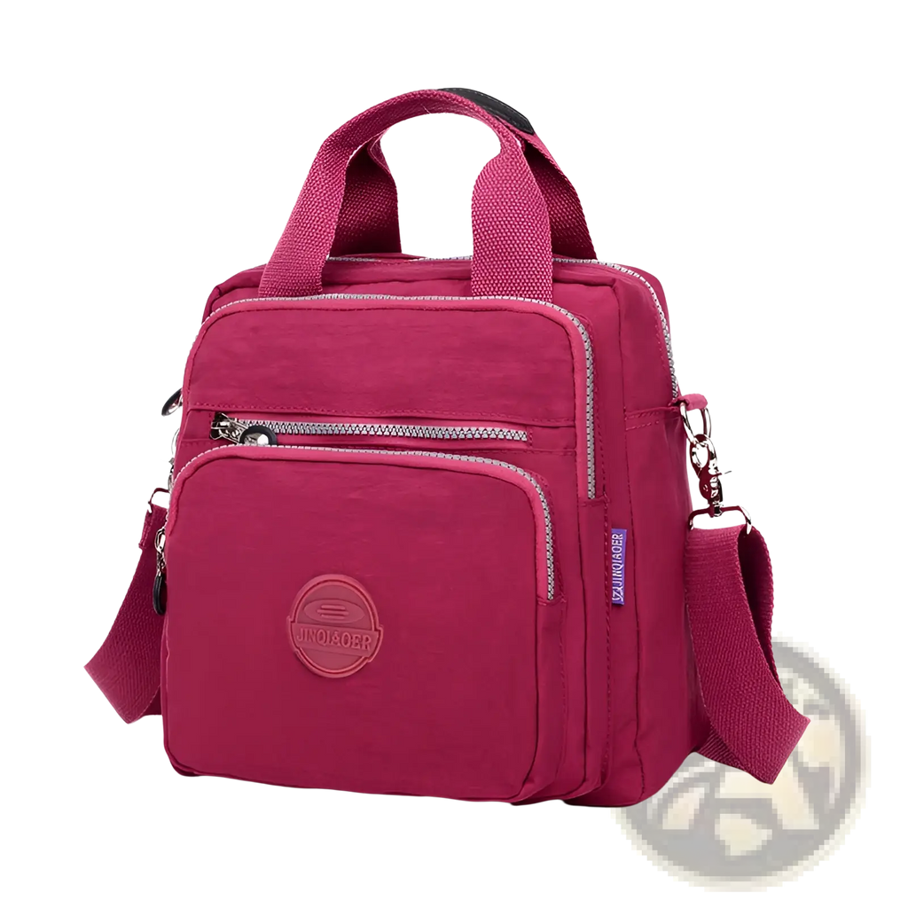 A vibrant fuchsia nylon magenta multi-functional crossbody bag with top handle, adjustable strap, and zippered compartments
