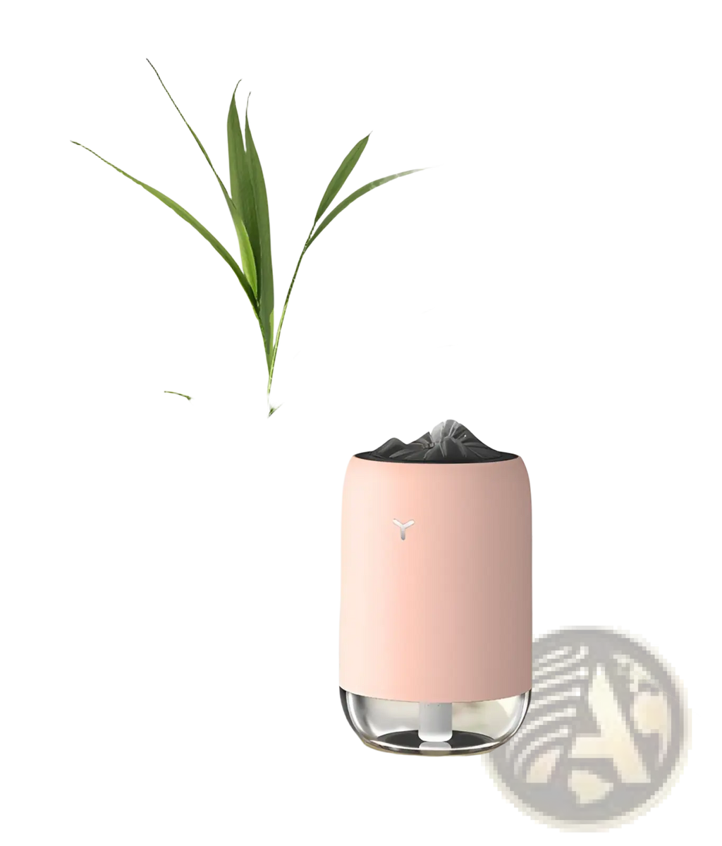 Pink cylindrical Magic Flame humidifier mini USB ultrasonic aroma diffuser with clear glass base and black top emitting mist