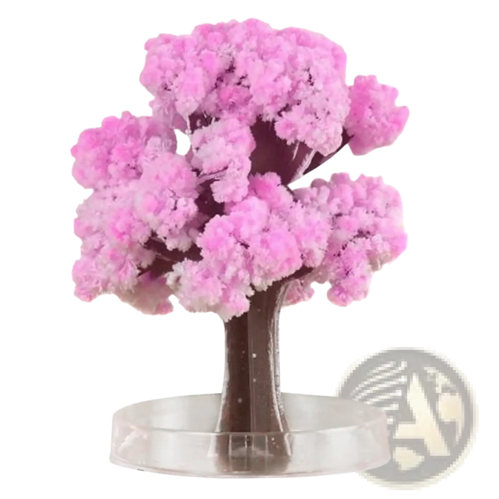 Magic growing Christmas tree crystal tabletop toy featuring a pink crystalline cherry blossom tree with dark brown trunk and transparent base
