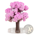 Magic growing Christmas tree crystal tabletop toy featuring a pink crystalline cherry blossom tree with dark brown trunk and transparent base