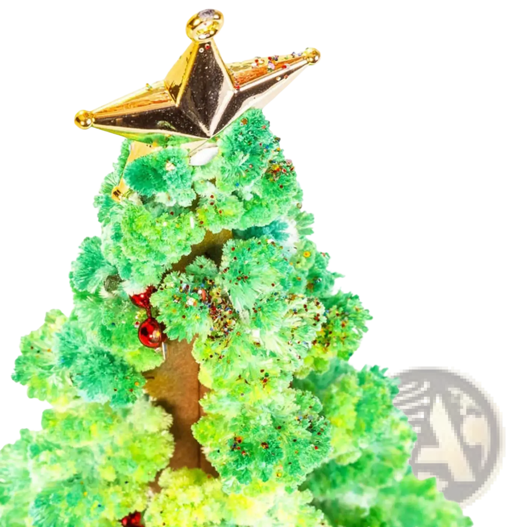 A festive green crystalline magic growing christmas tree tabletop toy with a gold star topper and red ornaments