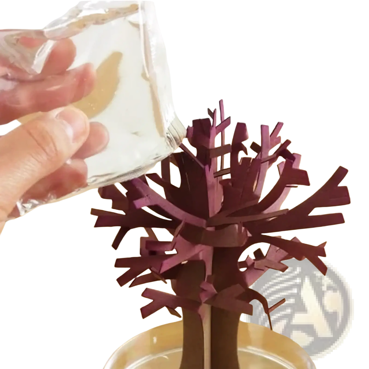 Magic growing christmas tree crystal tabletop toy featuring a maroon layered paper tree with a brown trunk