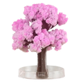Magic growing Christmas tree crystal tabletop toy featuring a pink crystalline cherry blossom tree with dark brown trunk and transparent base