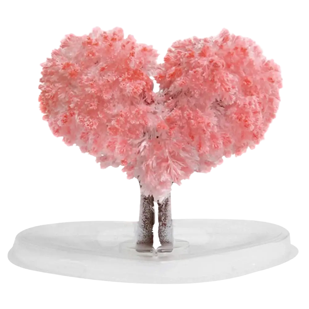 Pink crystalline heart-shaped tree sculpture with textured branches on clear base magic growing christmas tree toy