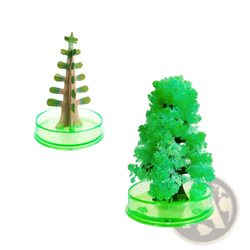 A vibrant green crystalline magic growing crystal christmas tree decor formed from a science kit with frosty structure