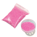 Pink glitter hydrophobic magic sand in clear bag with matching pink container for kids diy waterproof toy