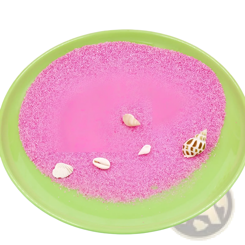 A vibrant pink fine-grained sand hydrophobic waterproof diy toy with seashells in a green plate for kids