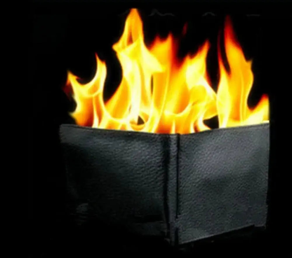 Vibrant orange and yellow flames erupting from a matte black rectangular fire pit in the magic blaze minimalist leather fire wallet