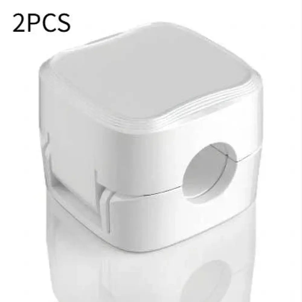 White plastic nebulizer mask with a square compact design and rounded edges for the magnetic square under desk cable organizer
