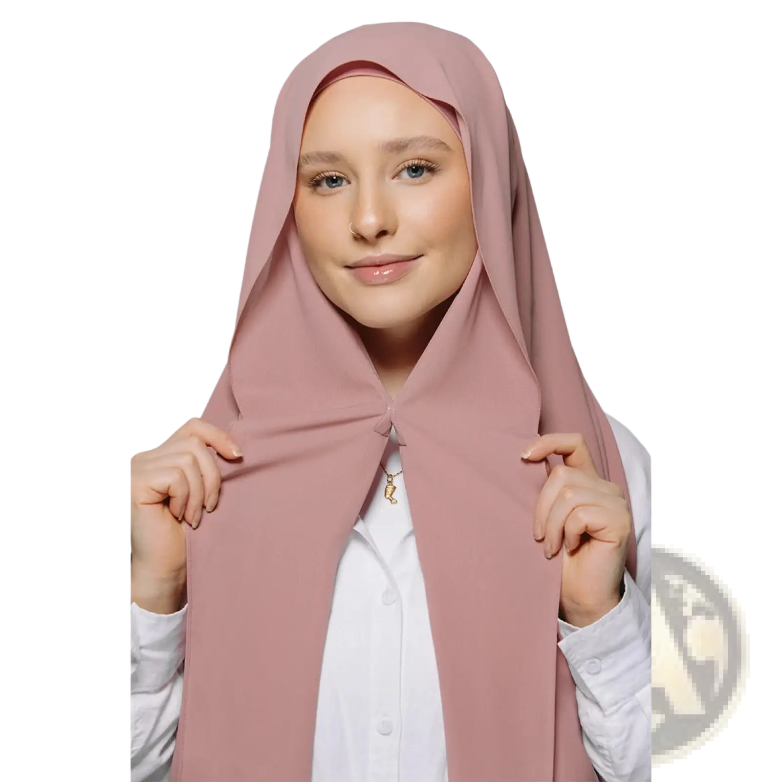A soft blush pink magnetic chiffon hijab with smooth flowing fabric draped elegantly over the head and shoulders