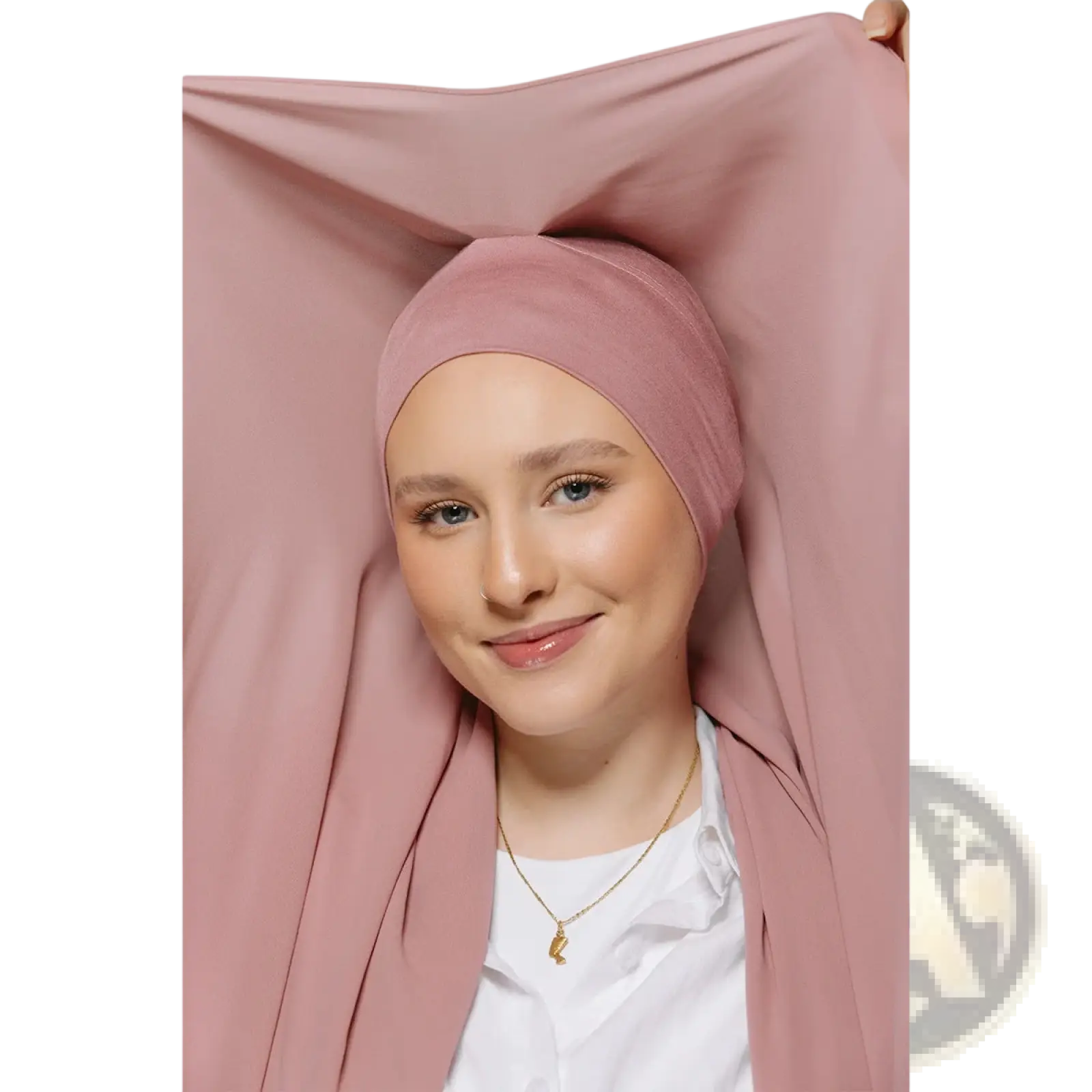 A soft pink stretchy chiffon hijab worn snugly over head and shoulders highlighting its magnetic feature