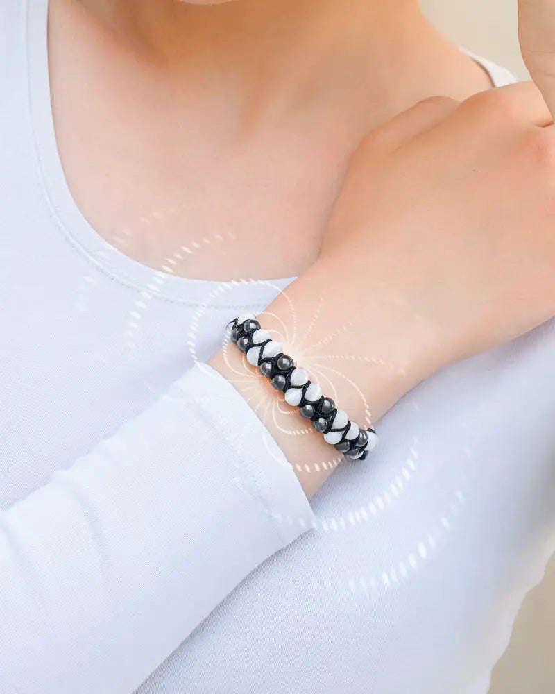 Black and white beaded bracelet with woven design featuring aaa grade moonstone and magnetic hematite beads