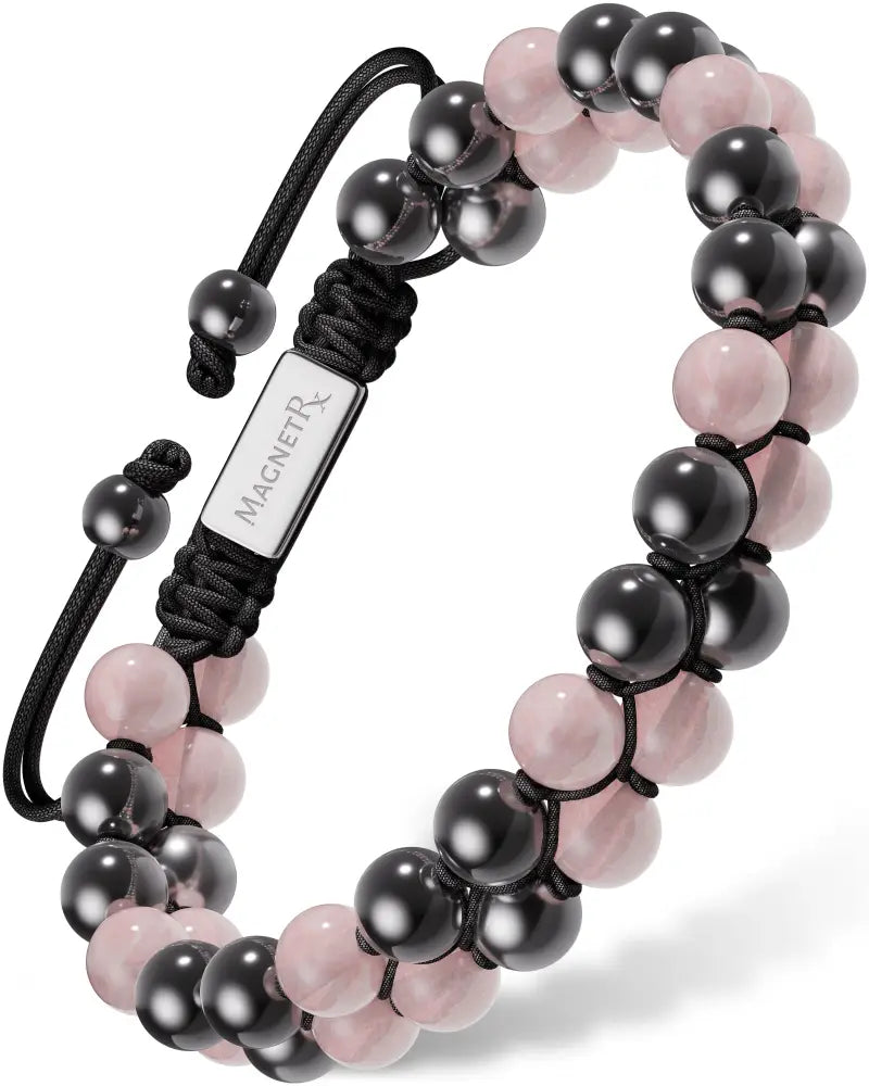 Rose quartz and magnetic hematite beaded bracelet in black and pink with a silver magnetr tag