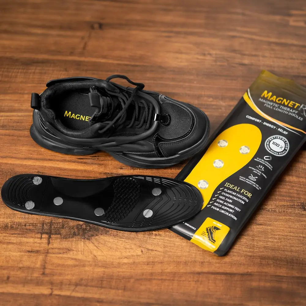 Black magnetic high power neodymium insole with silver circular magnets beside matching sneaker and Magnetrx packaging