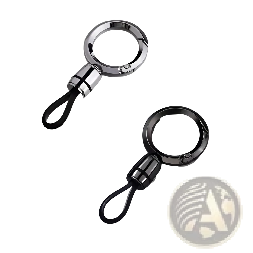 Two magnetic metal carabiner keychains with black rubber loops in polished silver and matte black on gray surface