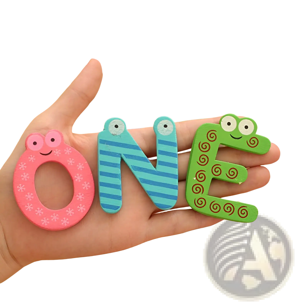 A hand holds colorful cartoonish wooden magnetic alphabet letters with googly eyes for kids toys