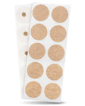 A sheet of light brown cork adhesive neodymium magnetic therapy patches arranged in a grid on white paper