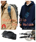 Black magnetic phone backpack clip universal mount with circular clamping mechanism and textured grip surfaces