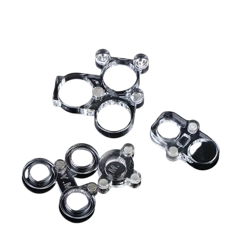 Clear acrylic fidget spinner charms with black centers and engraved lettering used with magnetic phone camera lens protector for soldering repair