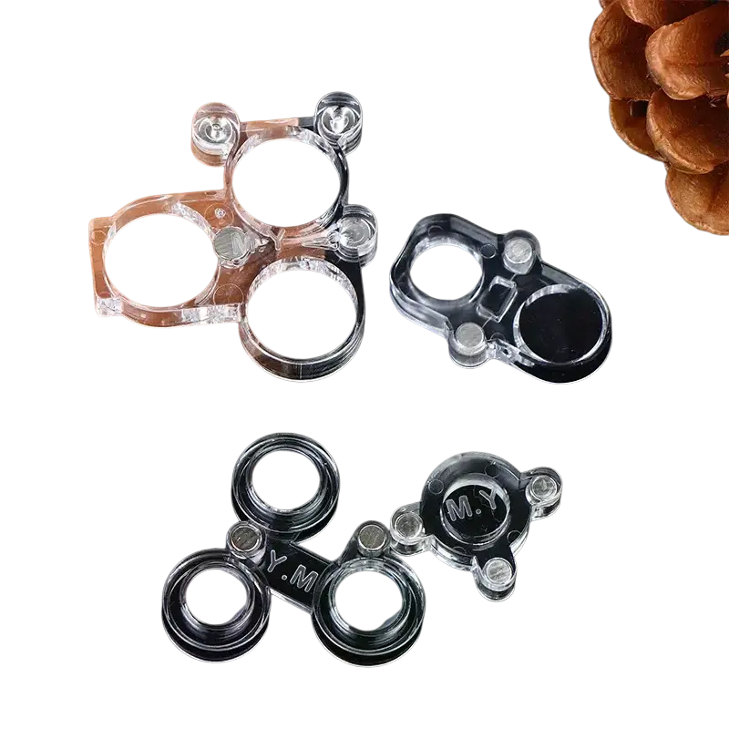 Clear plastic magnetic phone camera lens protectors with circular lenses and engraved m.y. markings for soldering repair