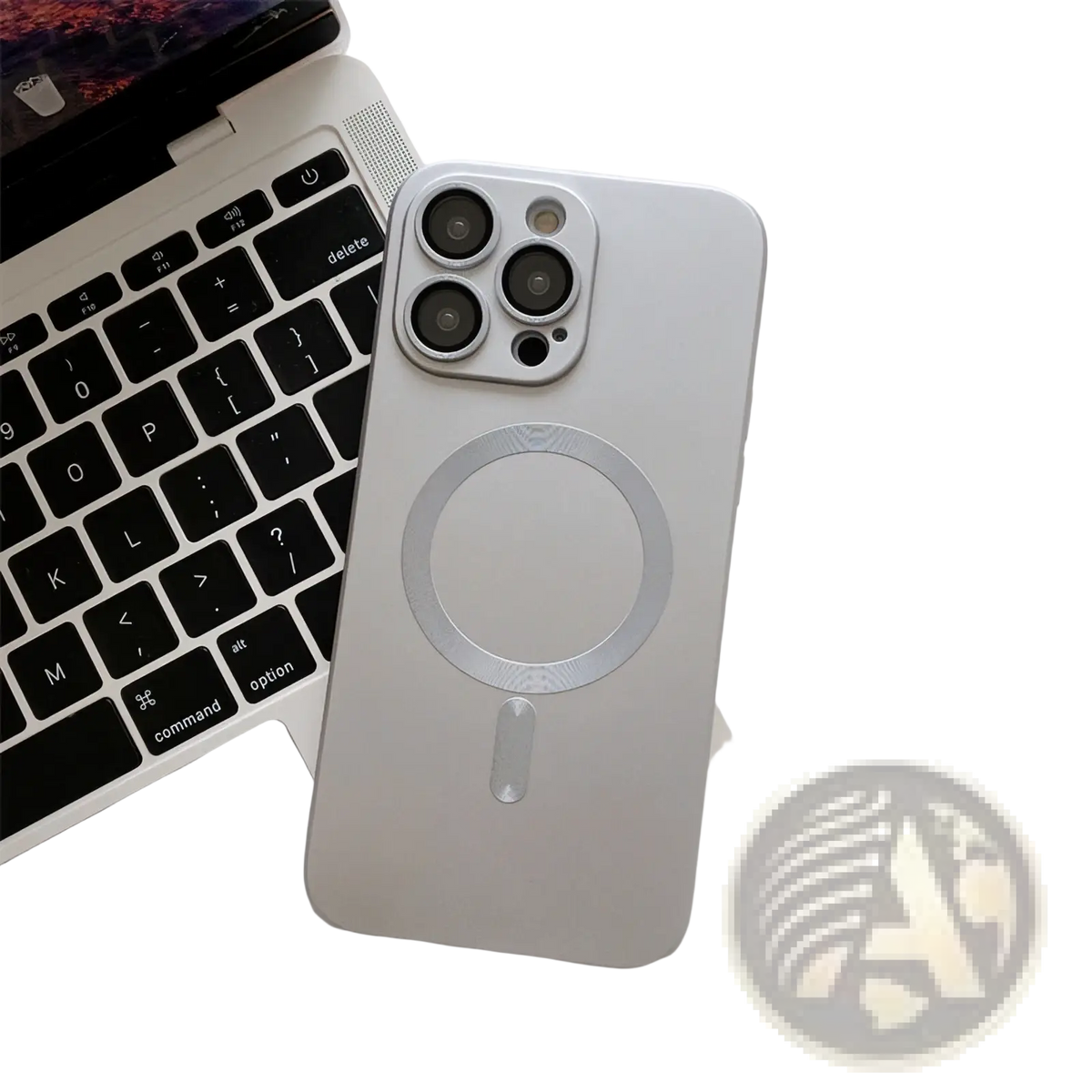 Silver magnetic phone case with lens protector showing back side and circular charging pad for iphone, sleek minimalist design