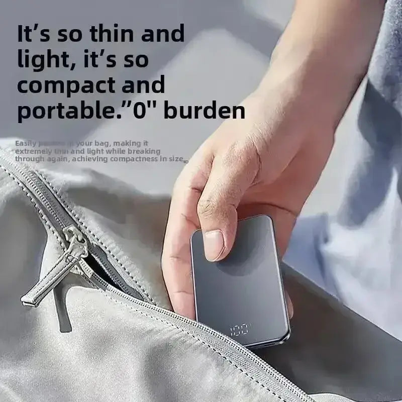 A sleek slim black magnetic power bank with silver accents featuring quick charge 20000mah capacity