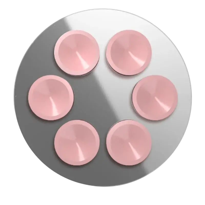 Six pink glossy circular magnetic suction caps arranged in a hexagonal pattern on a reflective silver surface for iphone pro max