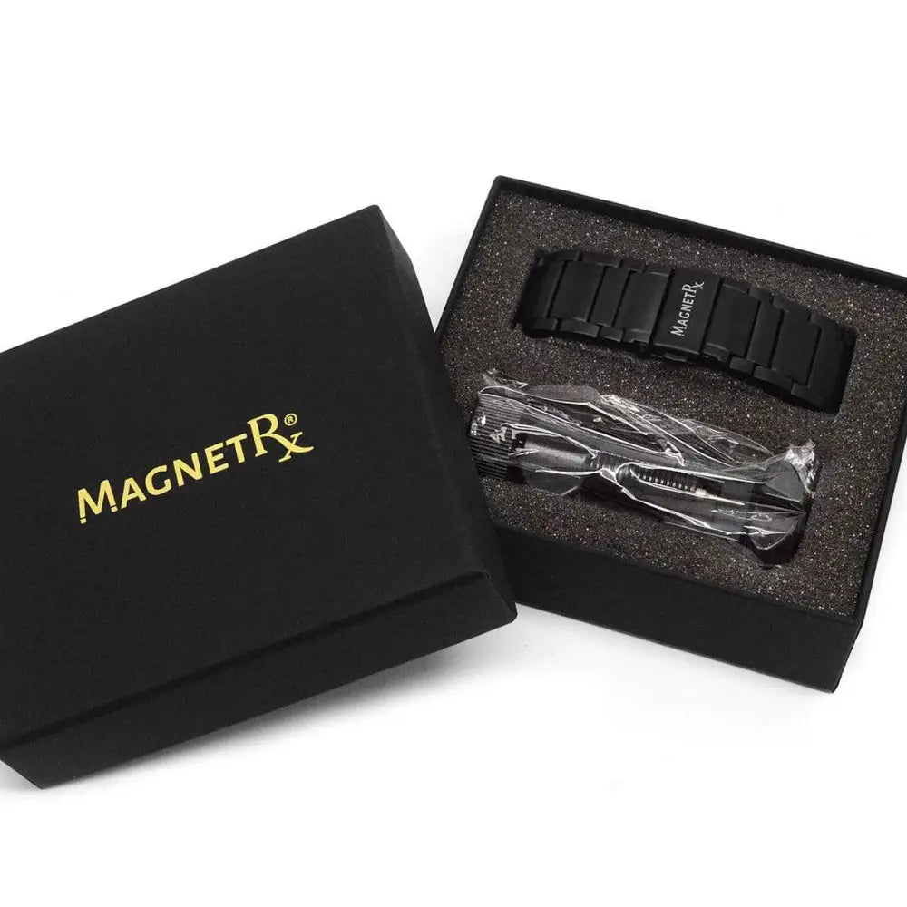 Black magnetic therapy stainless steel watch band with sleek segmented design and magnetrx logo engraved on a link