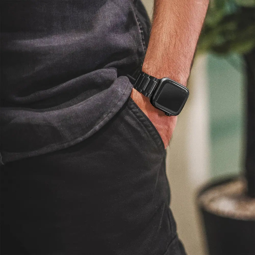 Black stainless steel apple watch with sleek rectangular case and magnetrx black magnetic therapy link band