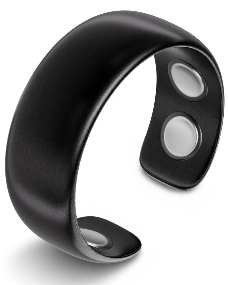 Brushed black stainless steel magnetic therapy cuff bracelet with sleek design and two silver-toned neodymium magnets inside