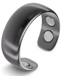 A sleek gunmetal matte magnetic neodymium therapy cuff bracelet with silver-toned magnets on its inner surface