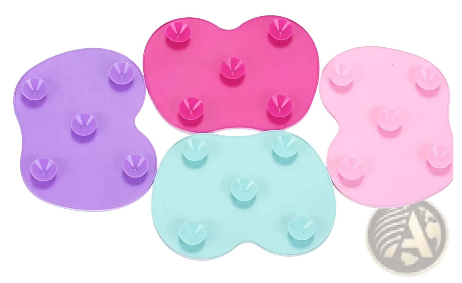 Set of four heart shaped silicone makeup brush cleaning mats in purple pink mint green and light pink with suction cups