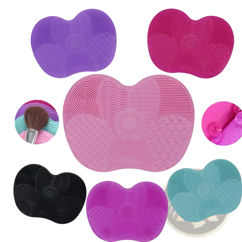 Heart shaped silicone makeup brush cleaning mats in vibrant purple pink black and teal for effective brush cleaning