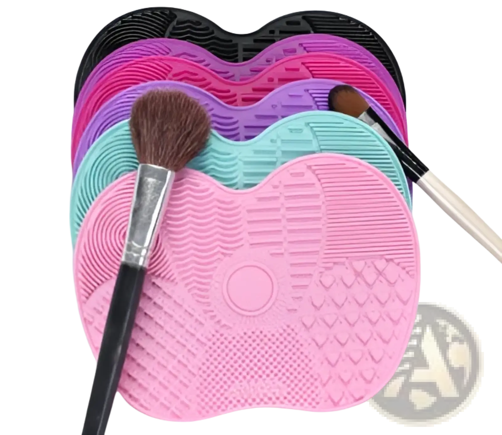 Pink silicone heart shaped makeup brush cleaning mat with textured surface and central circular indentation