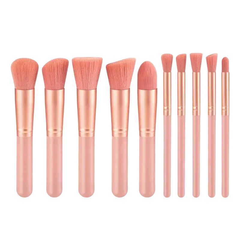 Set of ten rose gold finished professional synthetic makeup brushes with soft pink bristles and matching handles