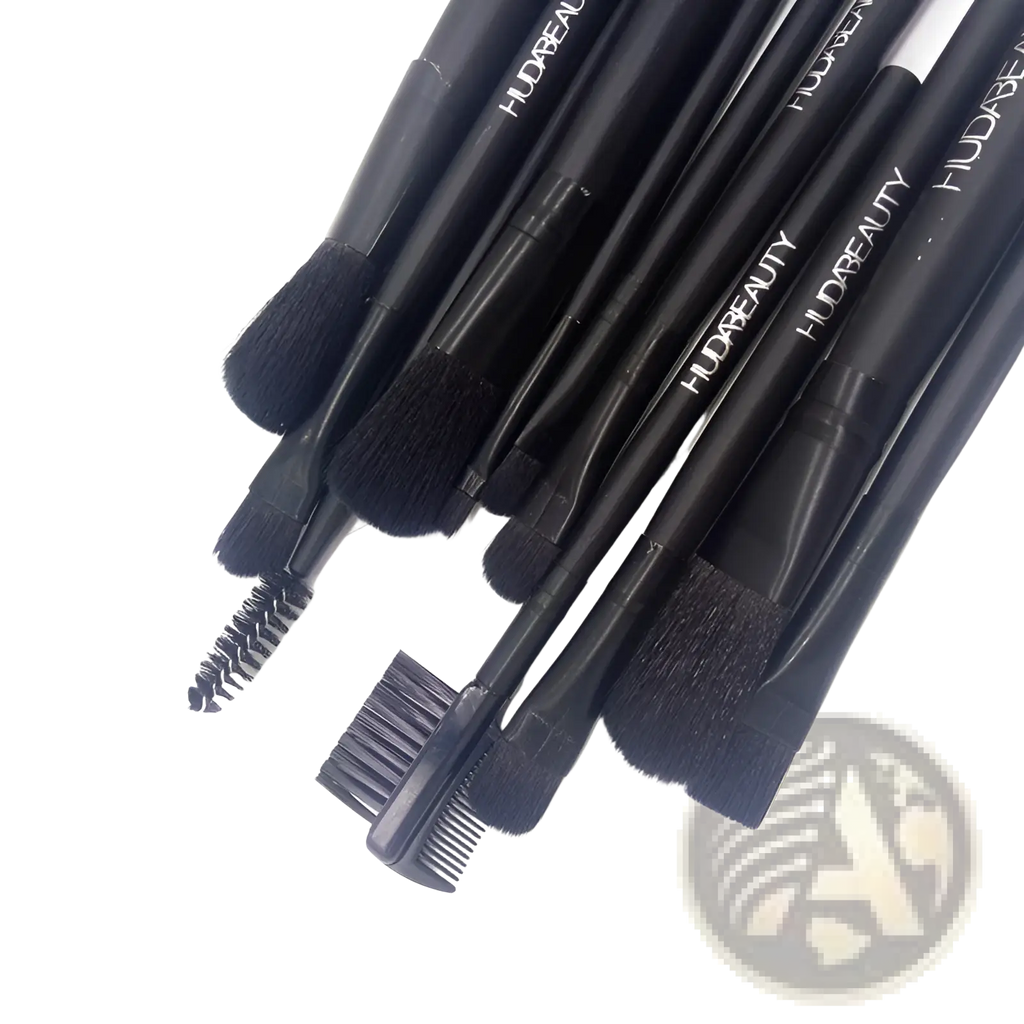 Set of 12 black huda beauty professional makeup brushes with various heads in a tin case for diverse cosmetic applications