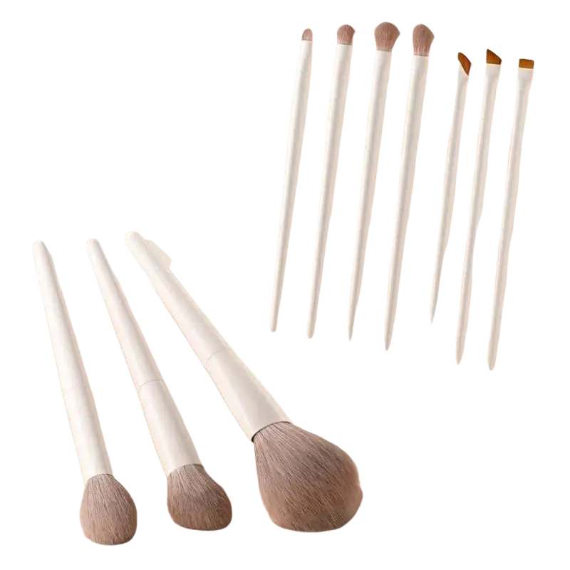 Set of seven white-handled makeup brushes with soft light brown bristles on beige surface from a 12-piece cosmetic tool set
