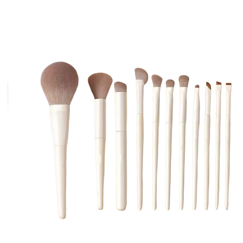A sleek white cylindrical brush case containing 12 elegant makeup brushes with light brown bristles and smooth handles