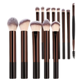 Set of 12 professional makeup brushes with sleek brown and black handles and soft gradient-tipped bristles