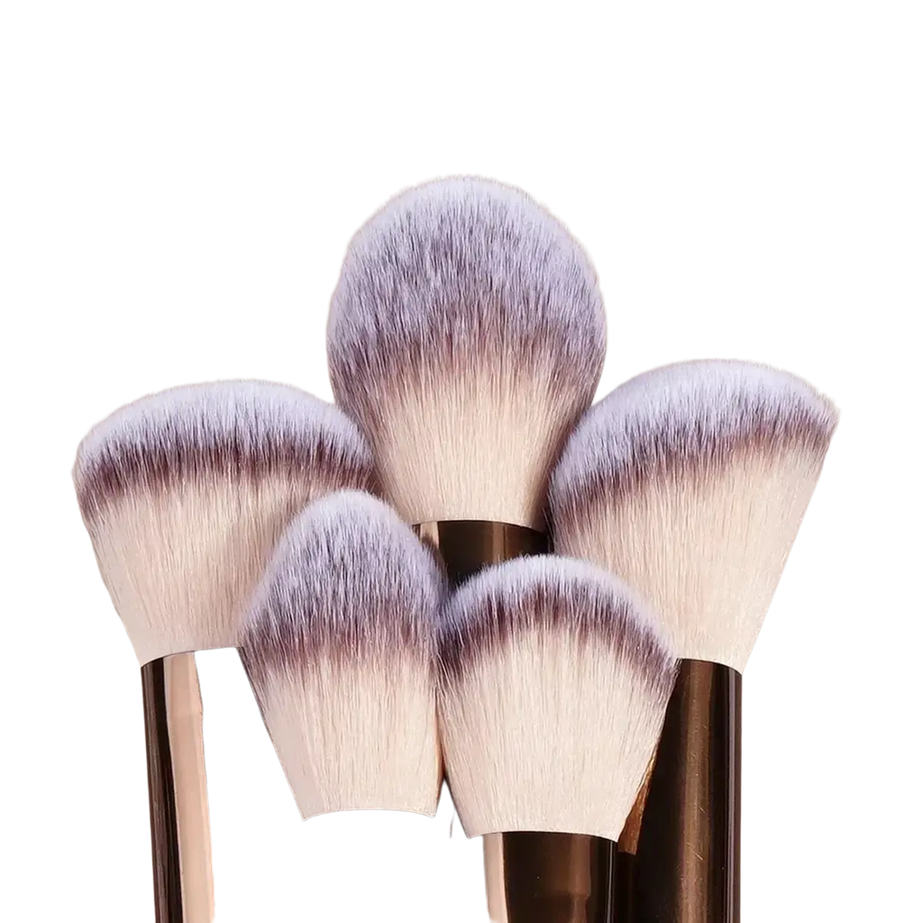 Set of five makeup brushes with fluffy white to purple gradient bristles and gold metallic handles for professional use