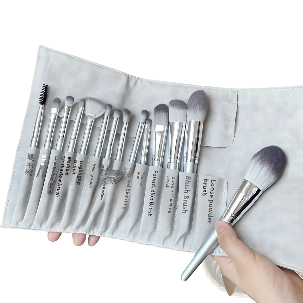 Makeup brush set with 15 silver and gray gradient brushes in a soft gray suede case for professional use